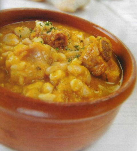 Locro (authentic dish of Argentine with maiz, chorizo, meat and ...